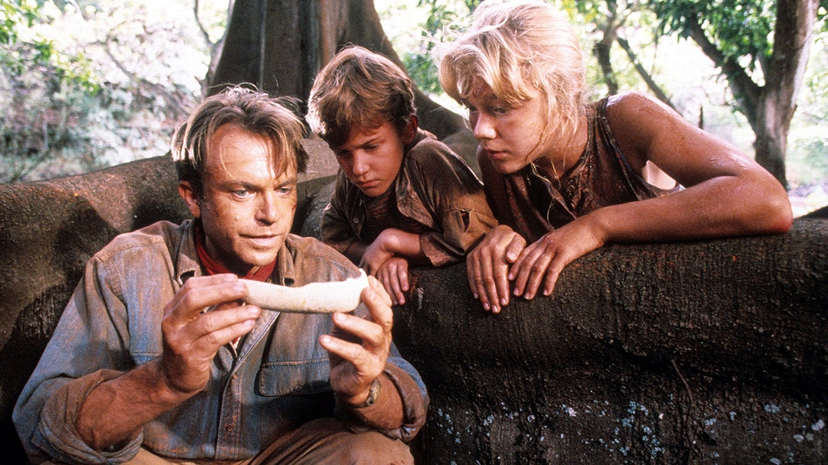 Sam Neill, Joseph Mazzello and Ariana Richards filming "Jurassic Park"