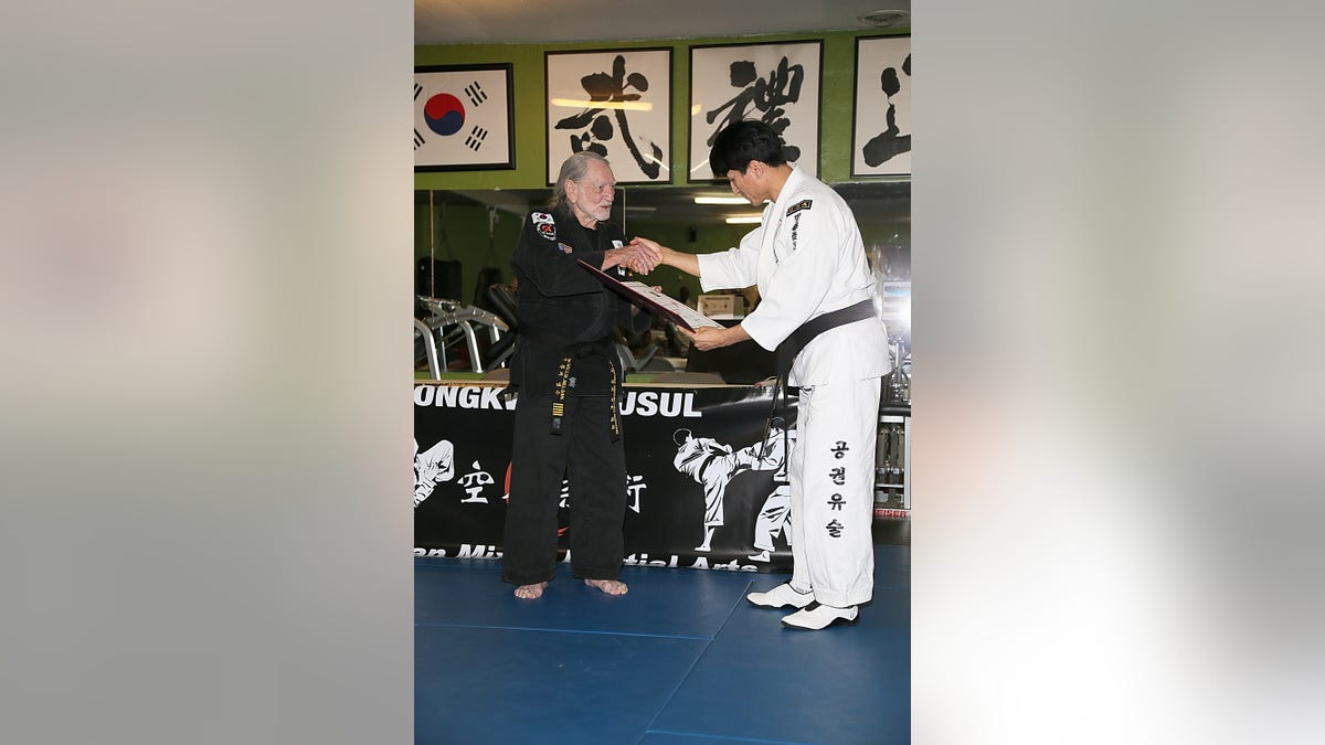 Willie Nelson during his during 5th Degree black belt award ceremony