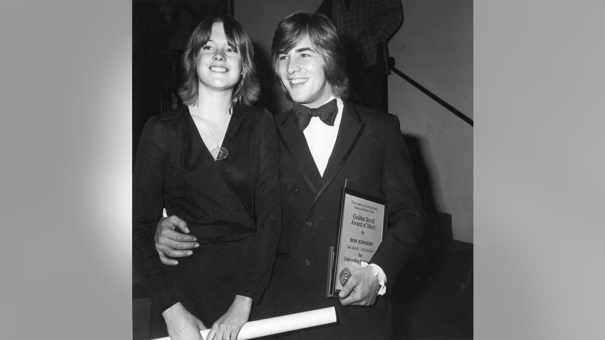 black and white photo of 14 year old Melanie Griffith and 22 year old Don Johnson