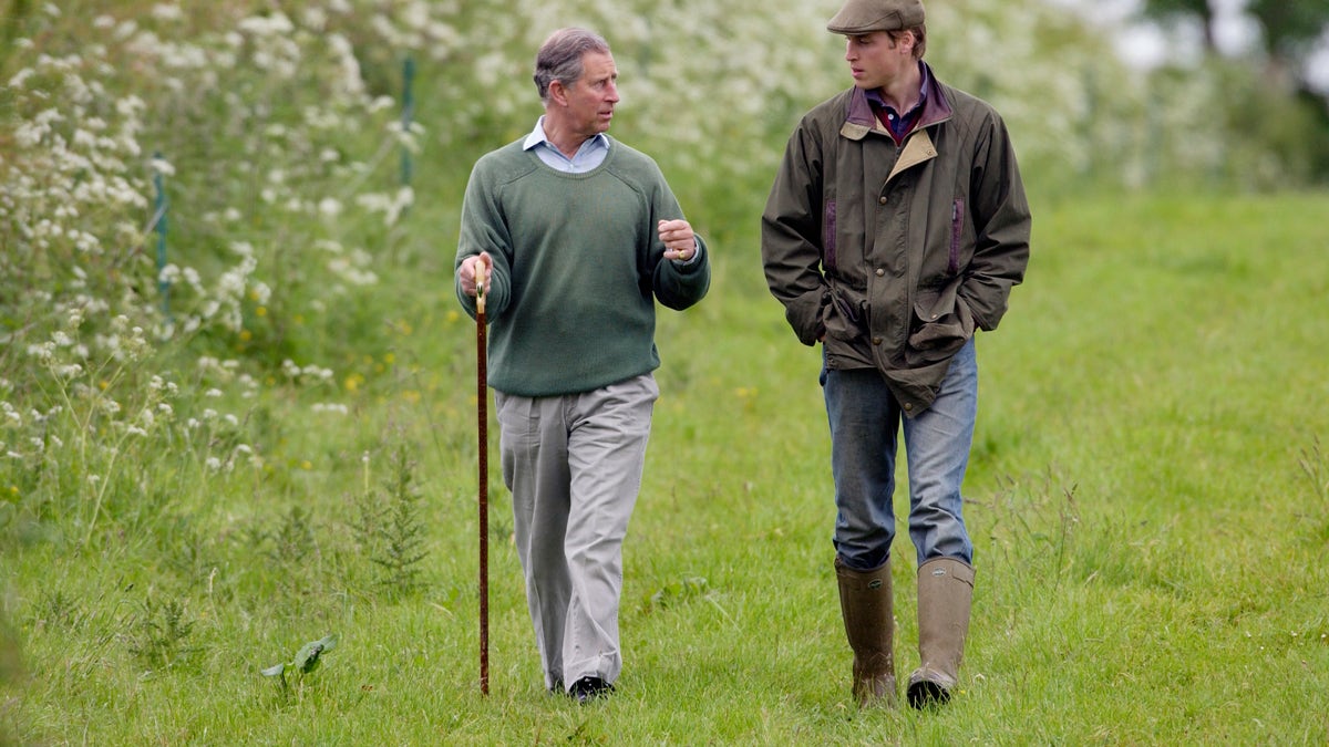 Prince William walking with Prince Charles