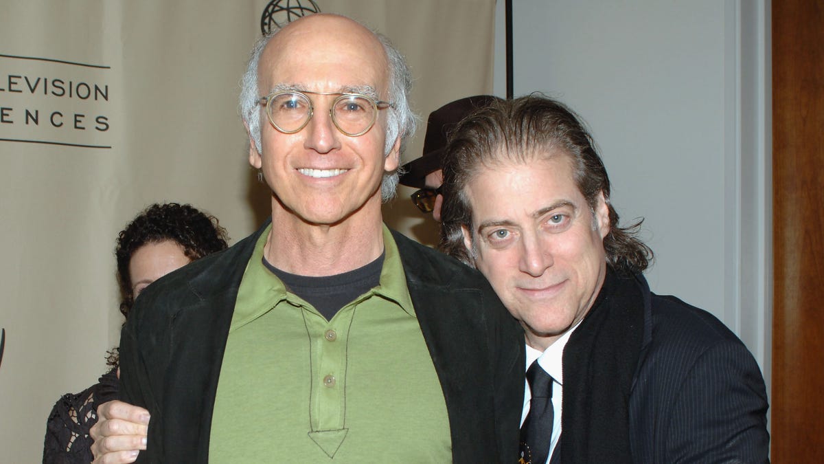 Larry David smiling next to Richard Lewis