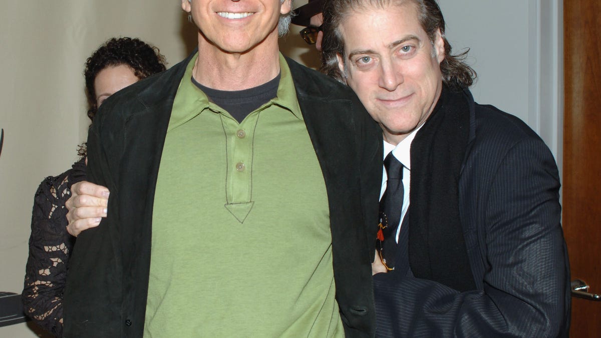 Larry David smiling next to Richard Lewis