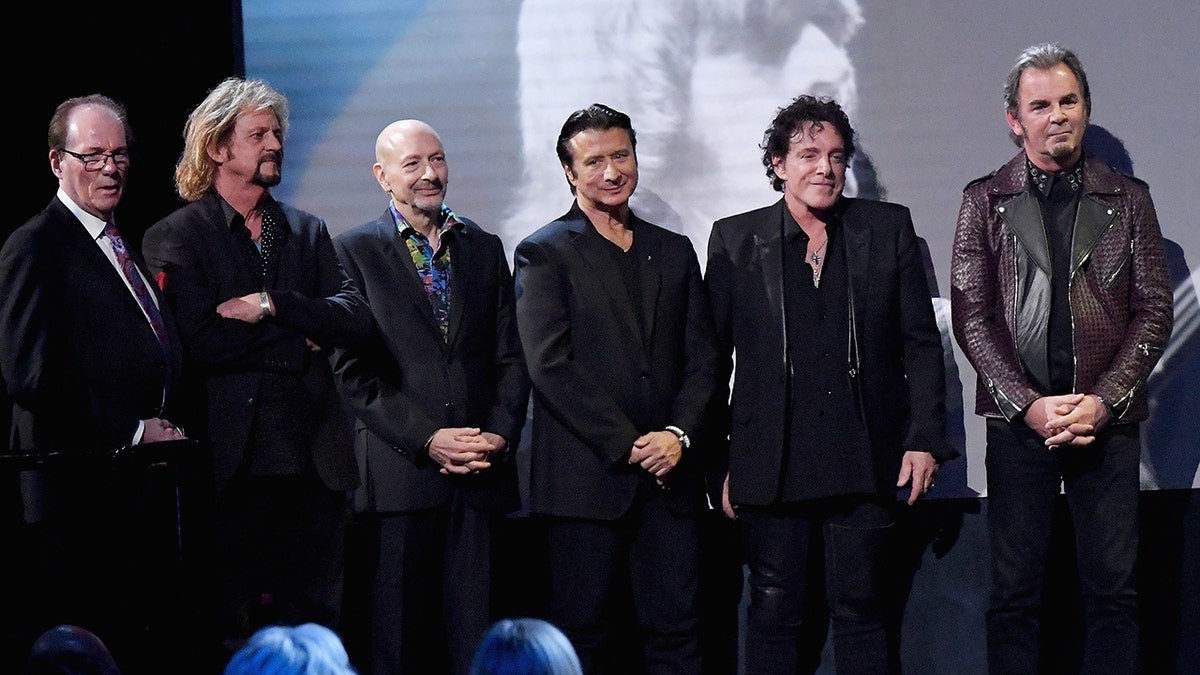 Aynsley Dunbar and the rest of Journey at the Hall of Fame ceremony