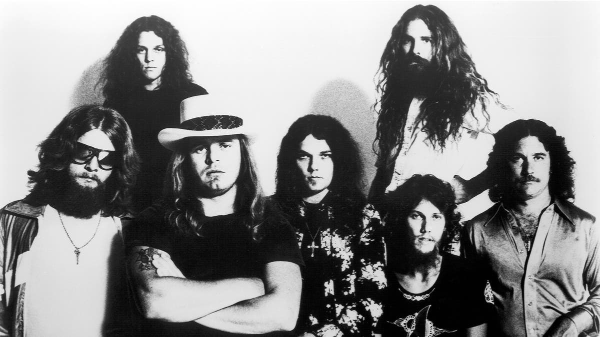 Leon Wilkeson, Allen Collins, Gary Rossington, Artimus Pyle {top}, Steve Gaines and Billy Powell in black and white portrait