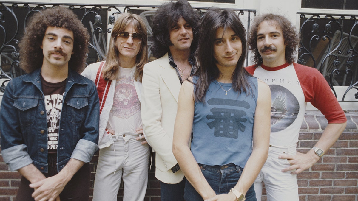 Journey posing for a photo in New York