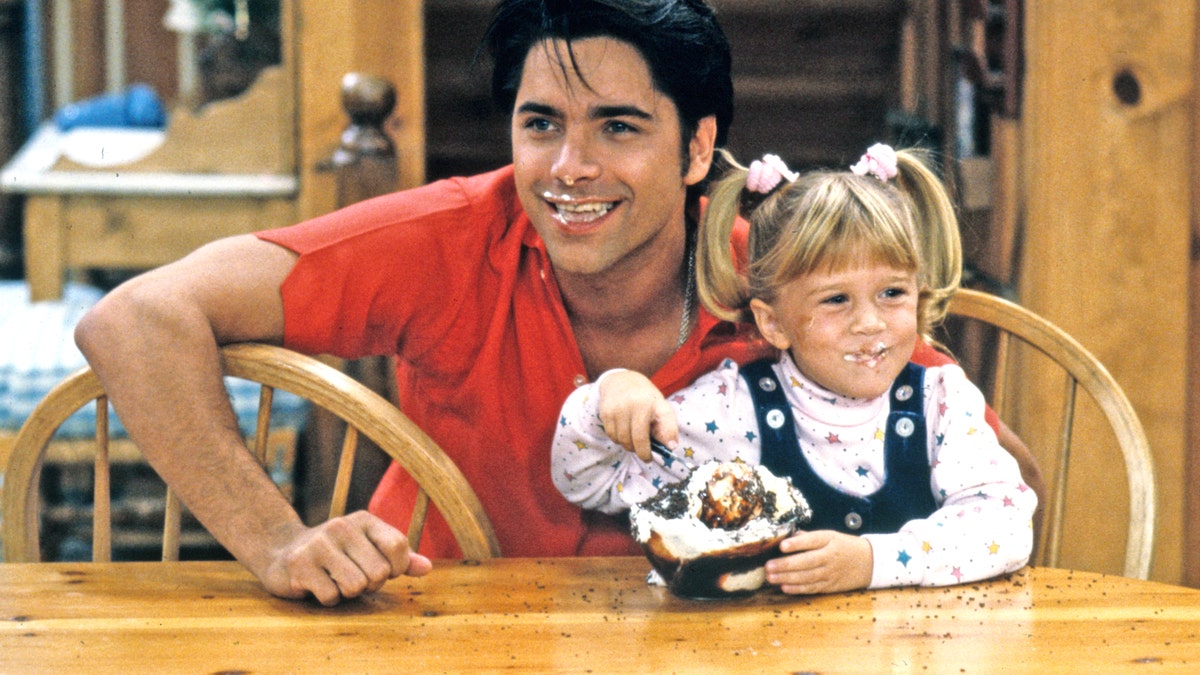 John Stamos Olsen twin on Full House set