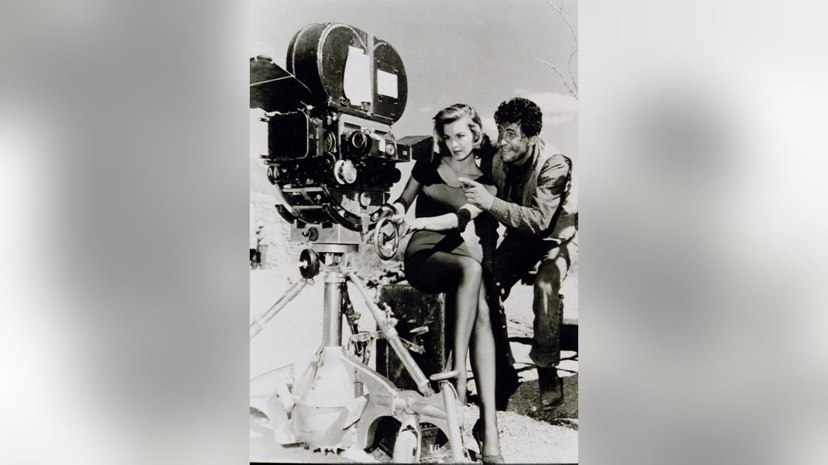 Angie Dickinson looking at a camera directed by Dean Martin
