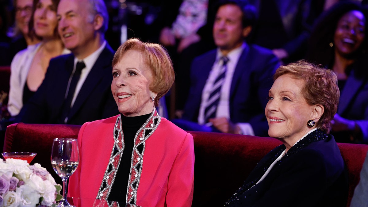 Carol Burnette and Julie Andrews sitting together at Carol Burnetts birthday tribute