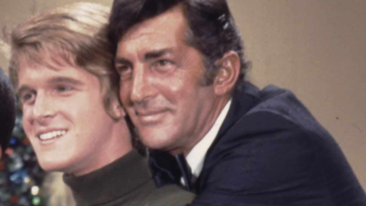 A close-up of Dean Martin embracing his son
