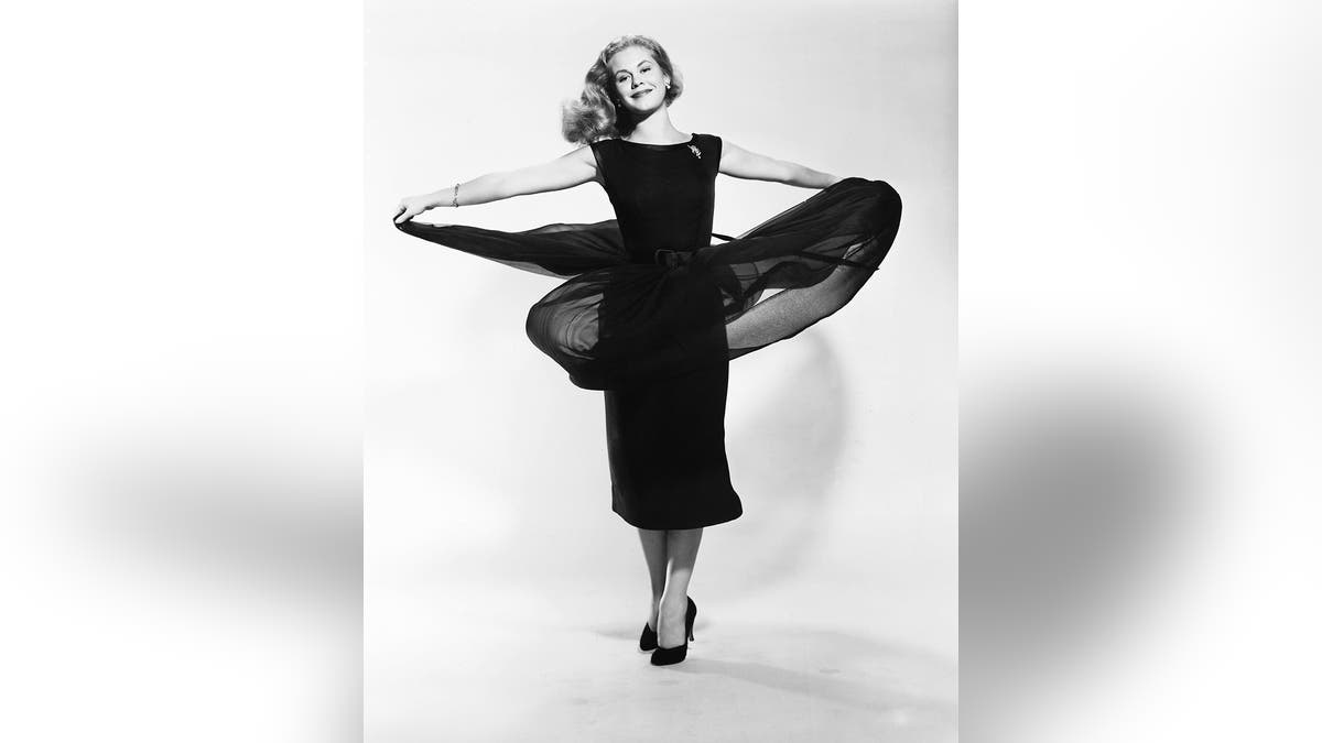 Elizabeth Montgomery twirling her black dress