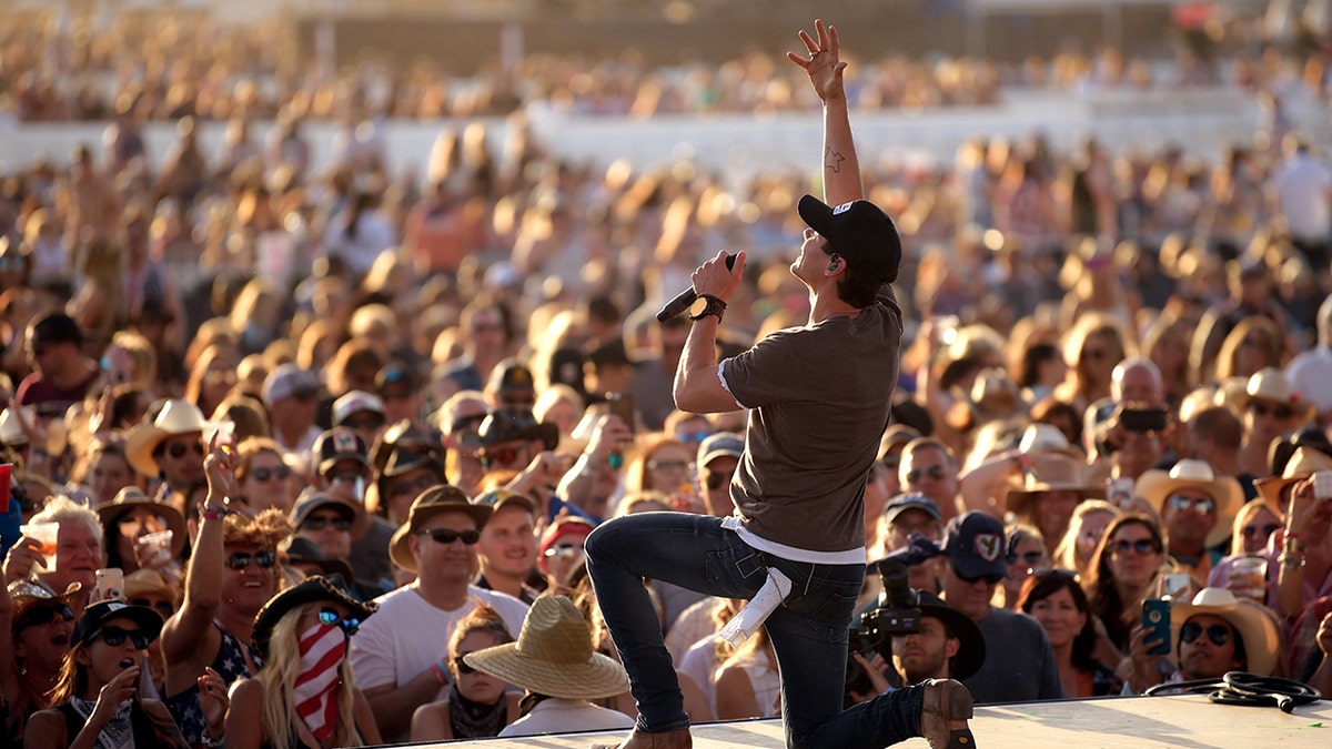 Granger Smith performing on stage in front of a crowd