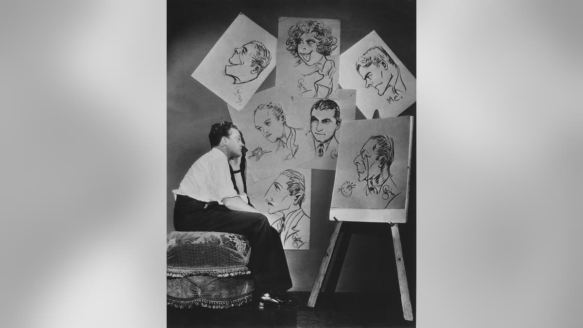 James Cagney looking at drawing cards