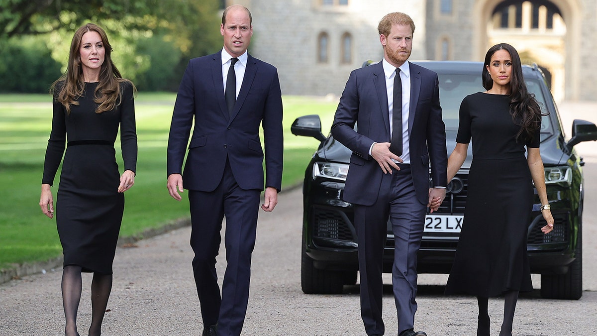 Catherine, Princess of Wales, Prince William, Prince of Wales, Prince Harry, Duke of Sussex, and Meghan, Duchess of Sussex walking together in front a car