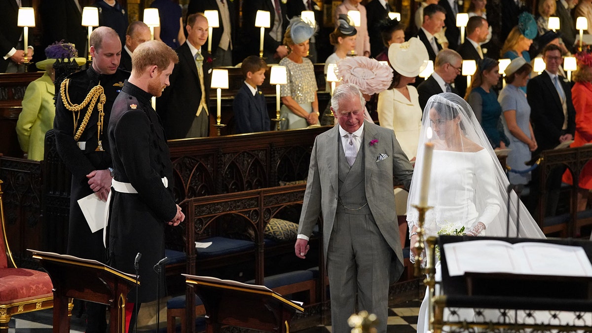 Prince Charles walking Meghan Markle down the aisle on her wedding day