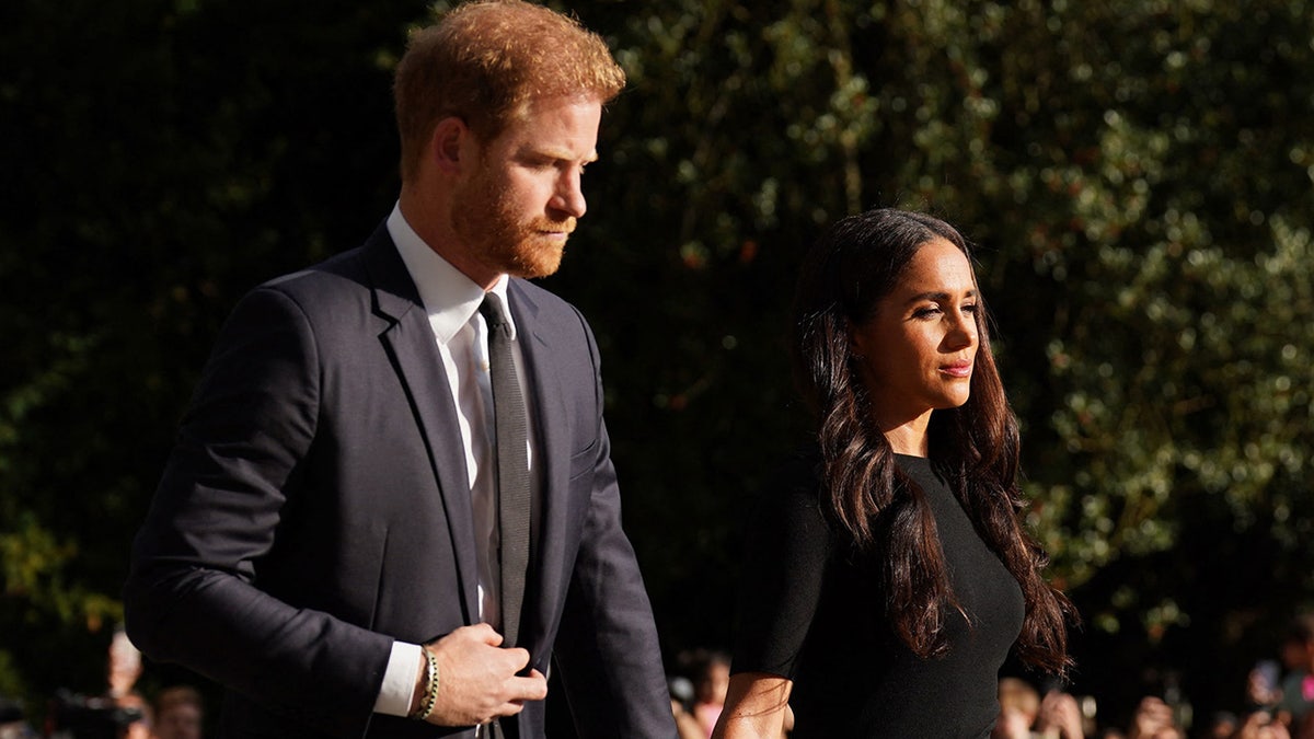Prince Harry and Meghan Markle wearing black in London