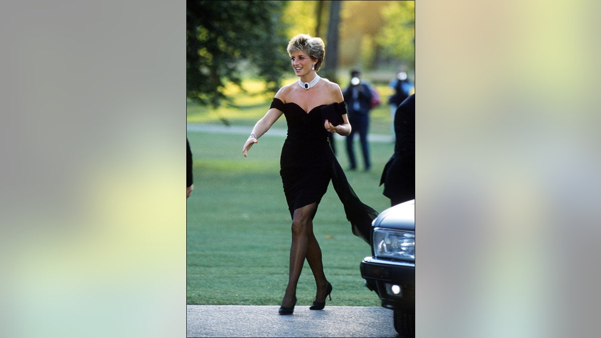 Princess Diana walking in her black revenge dress