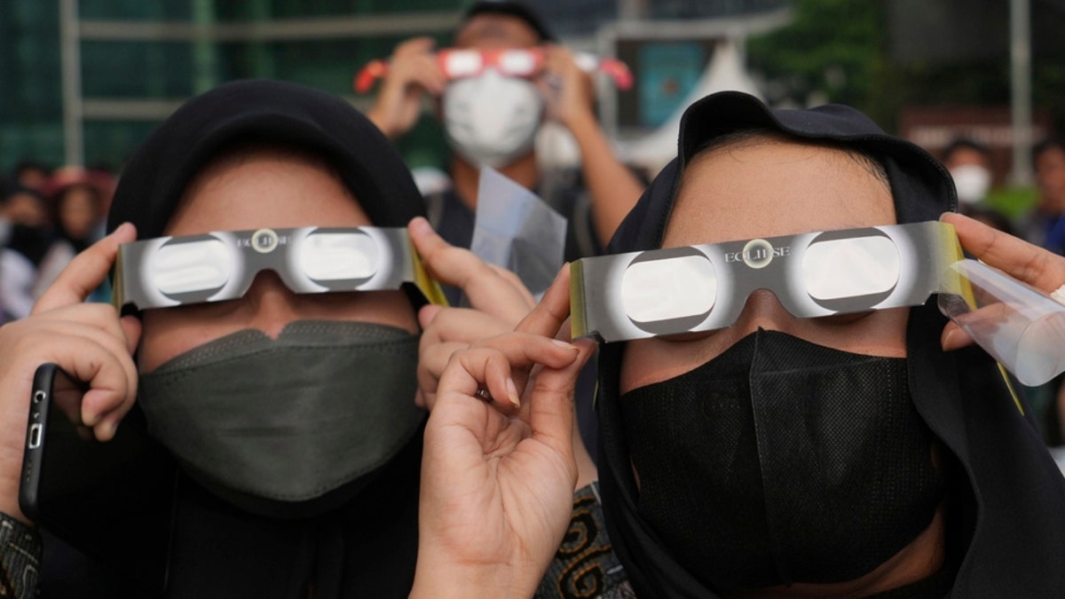 Indonesian women use protective glasses