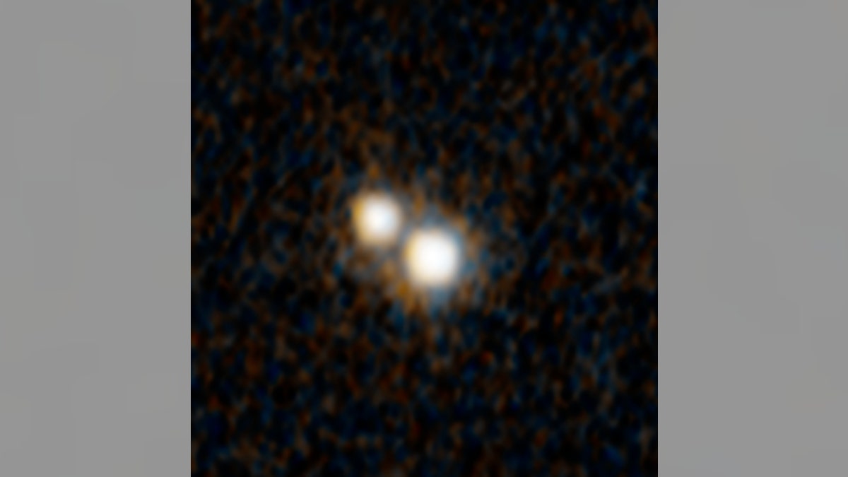 A Hubble Space Telescope photograph of a pair of quasars