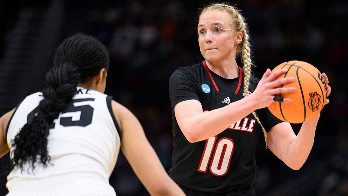 Hailey Van Lith looks to pass