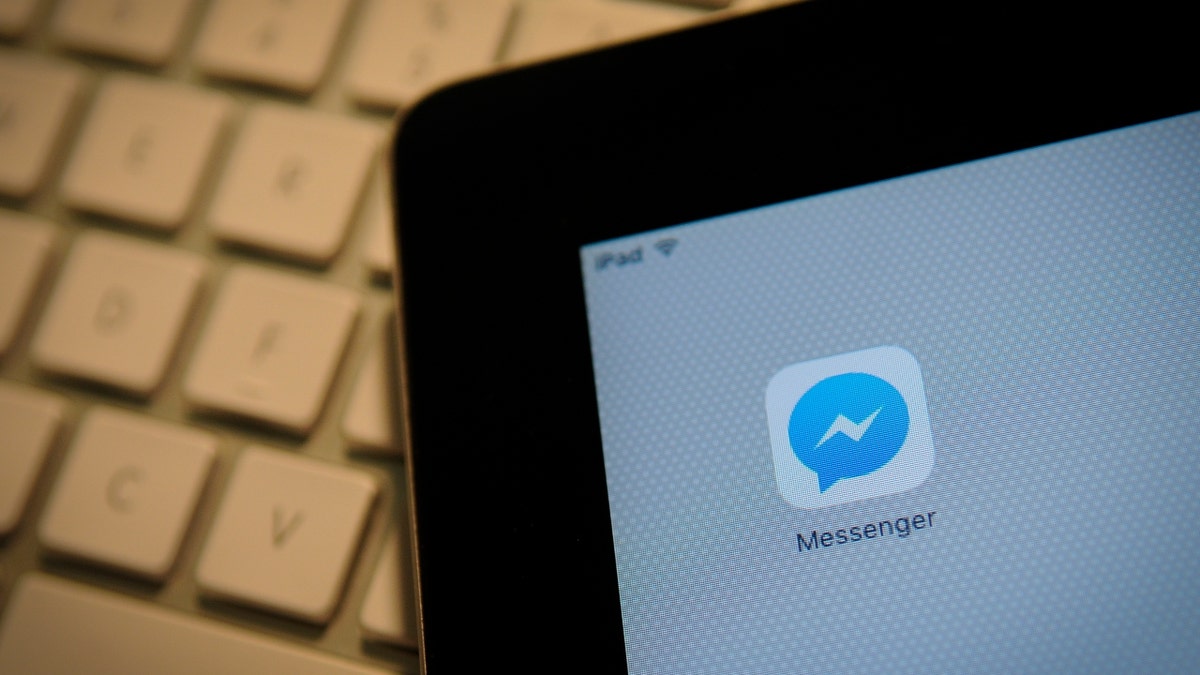 The Facebook Messenger application is seen on an iPad