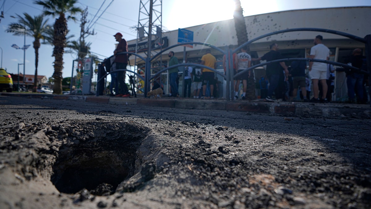 Rocket crater seen in northern Israel after barrage from Lebanon