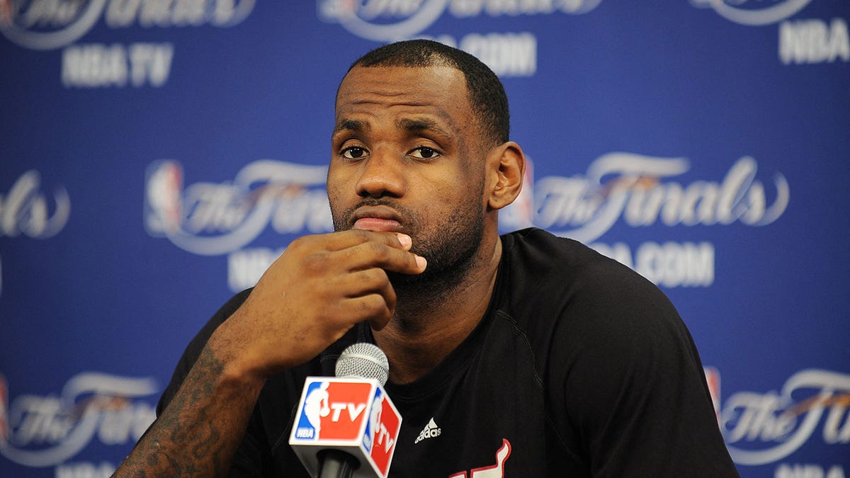 Miami Heat's LeBron James speaks to the media