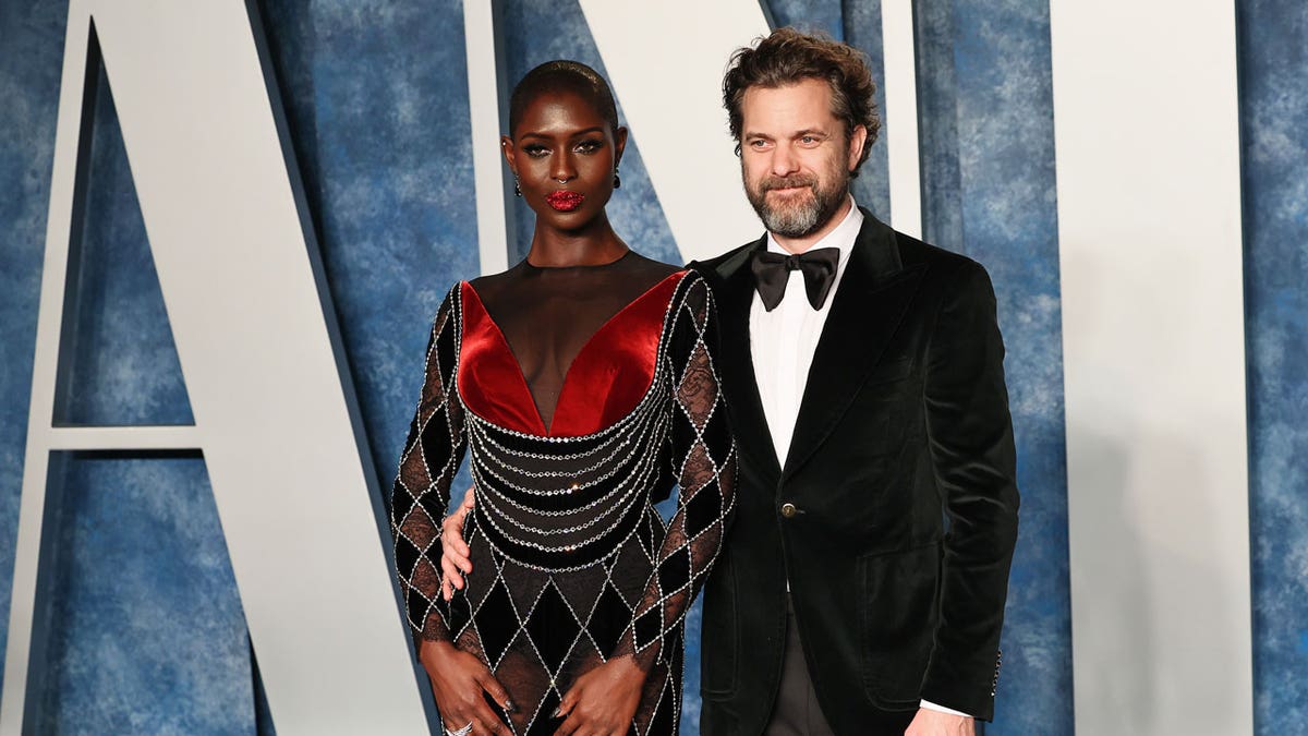 Joshua Jackson and his wife at the Oscars party