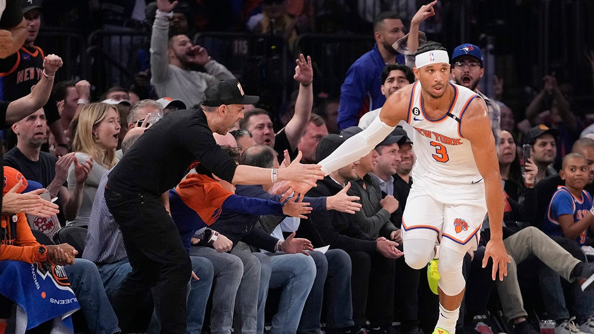 Josh Hart shakes hands of fans