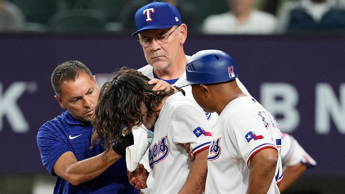 Rangers' Josh Smith hit in jaw with 88 mph pitch, taken to