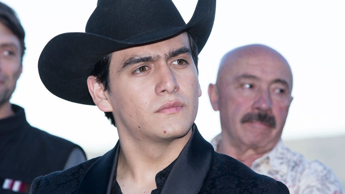 Julian Figueroa wearing a cowboy hat