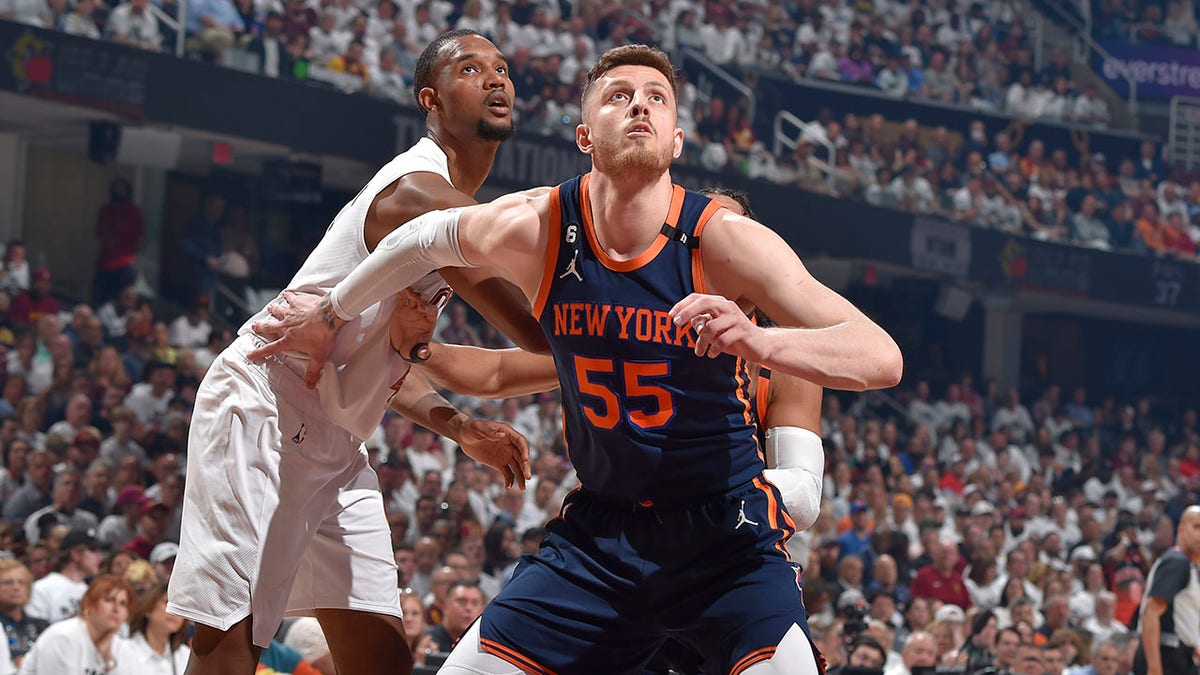 New York Knicks player boxes out during a game