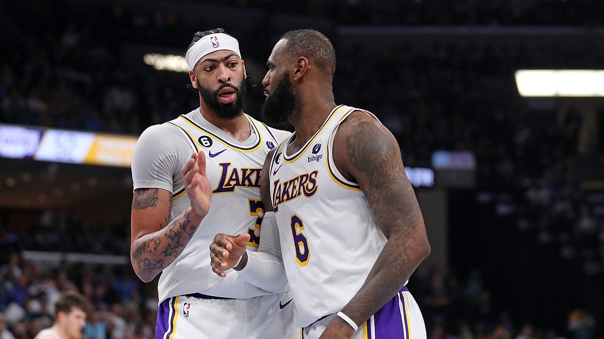 Anthony Davis and LeBron James react on court