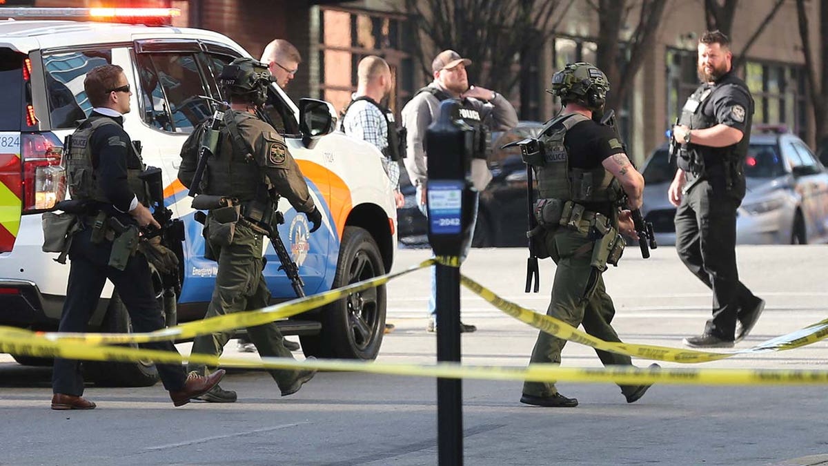 Police deploy at the scene of a mass shooting near Slugger Field baseball stadium in downtown Louisville, Kentucky