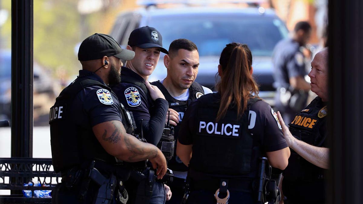 Law enforcement officers respond to an active shooter at the Old National Bank building