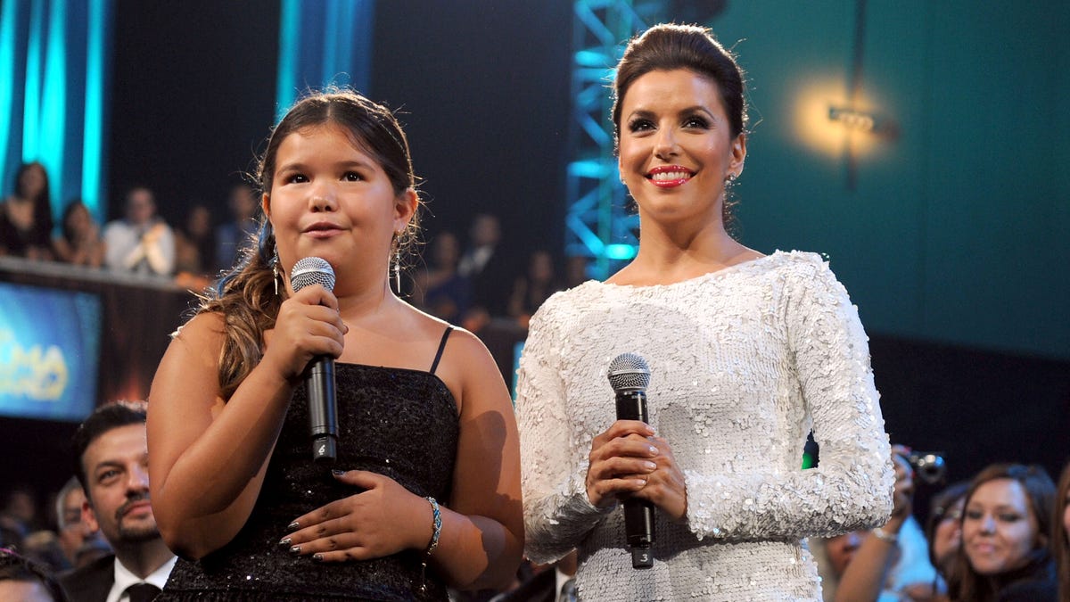 Eva Longoria and Madison De la Garza speak at an event