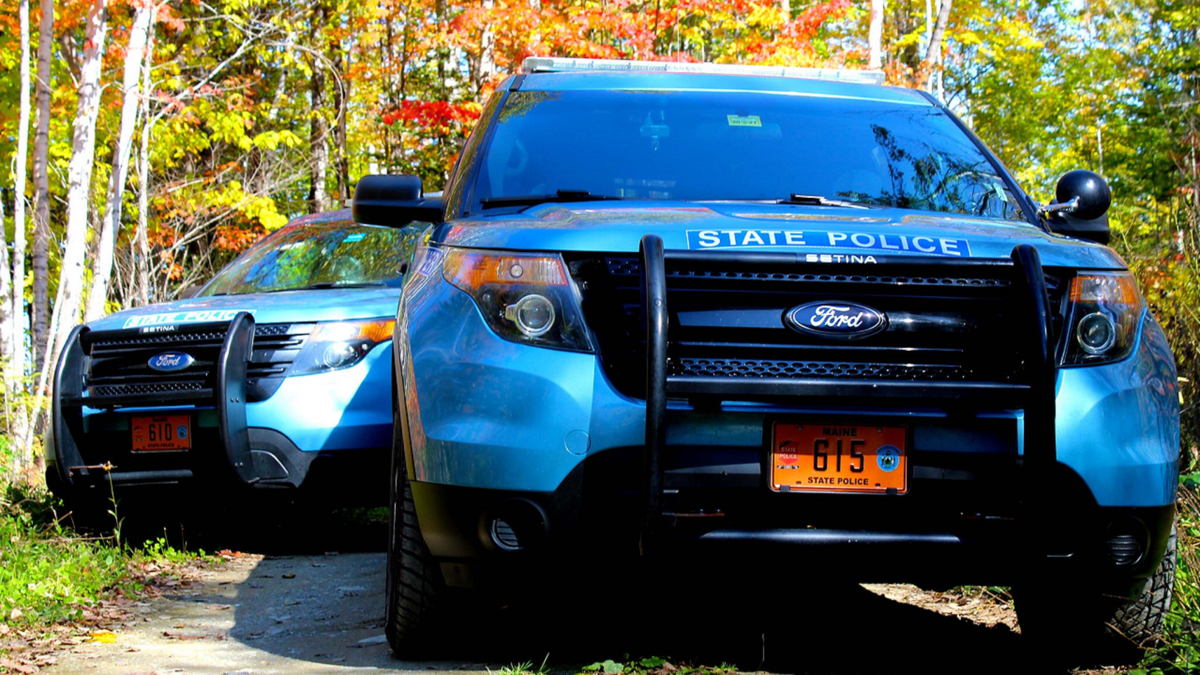 Maine State Police vehicles on road