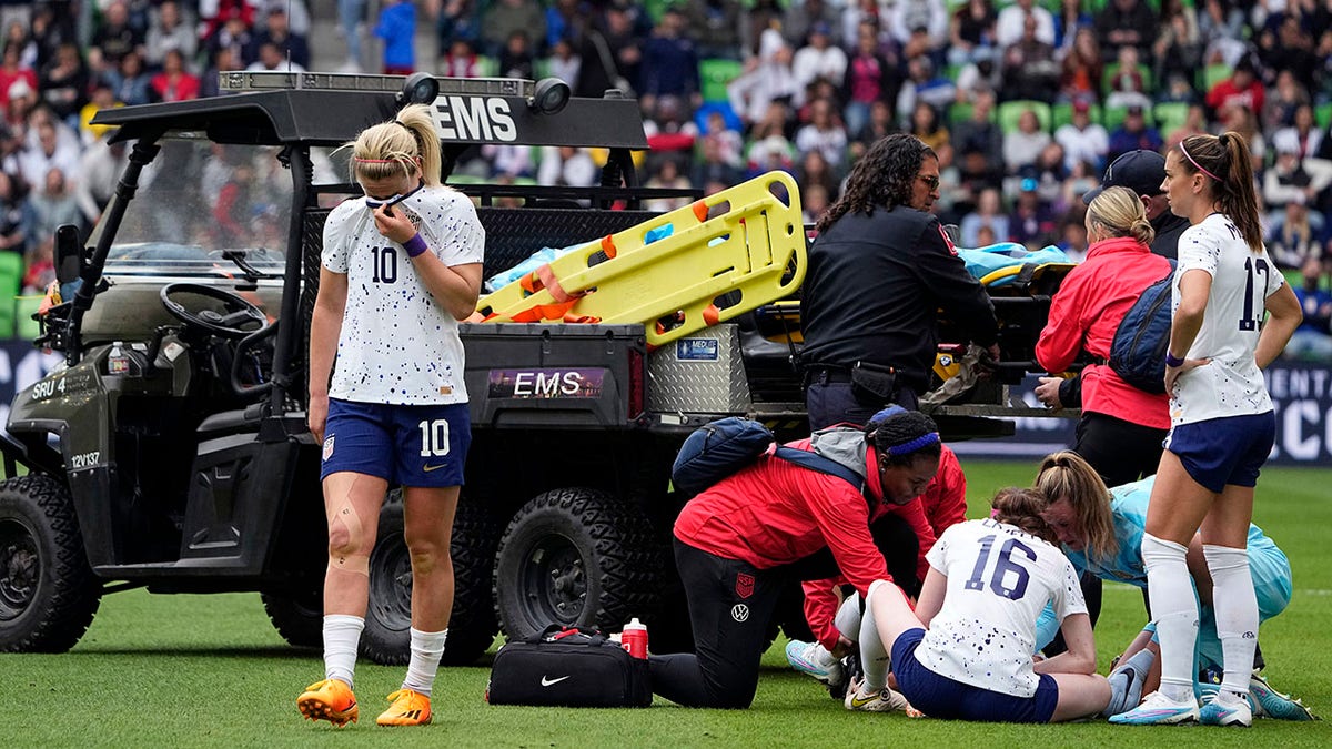 United States midfielder Lindsey Horan stands near teammate Mallory Swanson