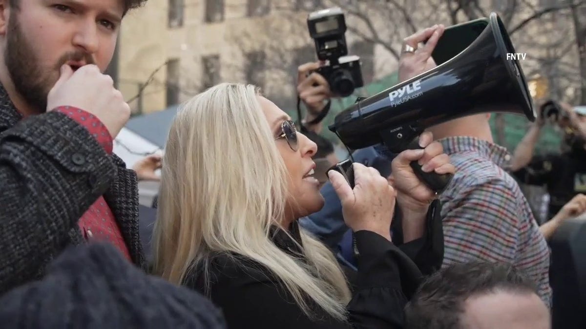Marjorie Taylor Greene delivers a message to NYC Mayor Eric Adams as she rallied outside of Manhattan Criminal Court ahead of Donald Trumps surrender