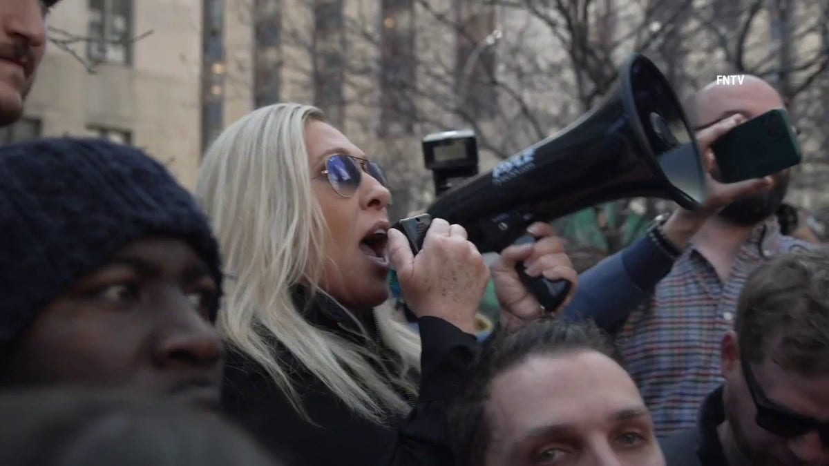 Marjorie Taylor Greene sends message to Eric Adams with bullhorn in hand ahead of Trumps arraignment.