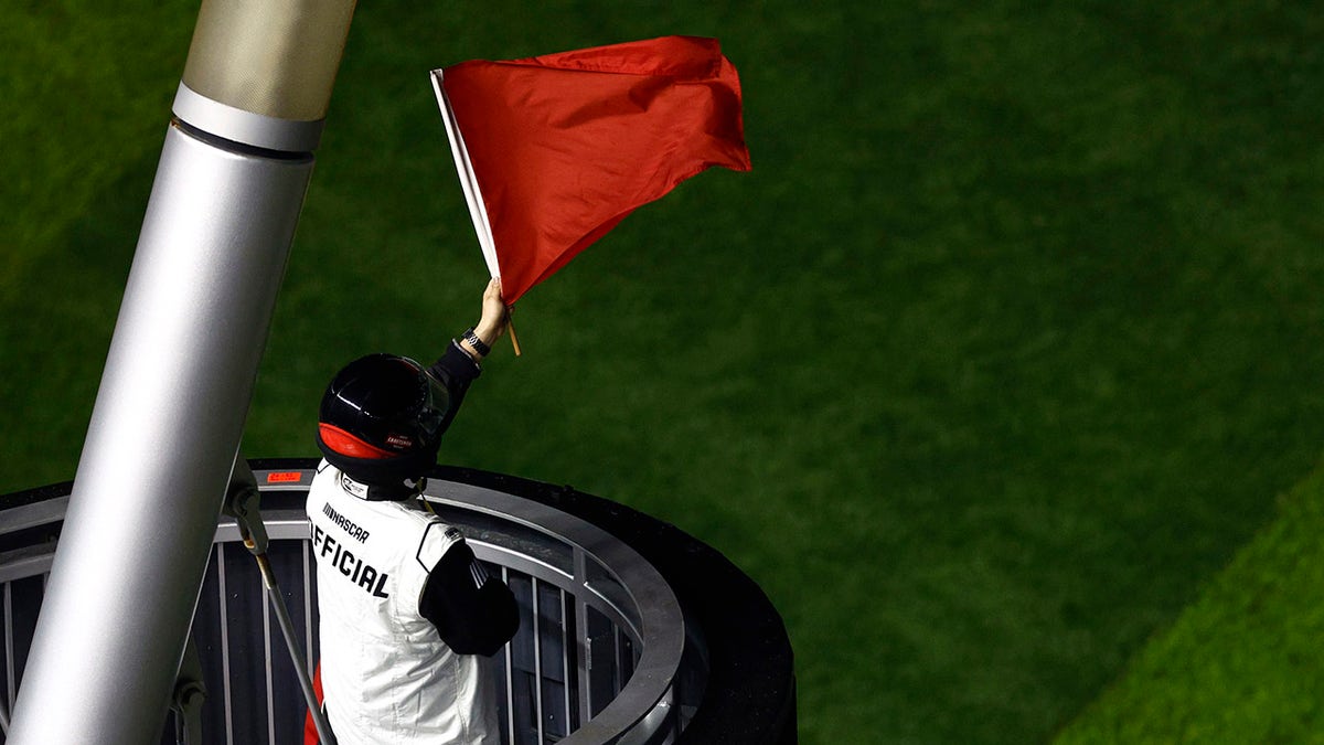 NASCAR official waves the red flag