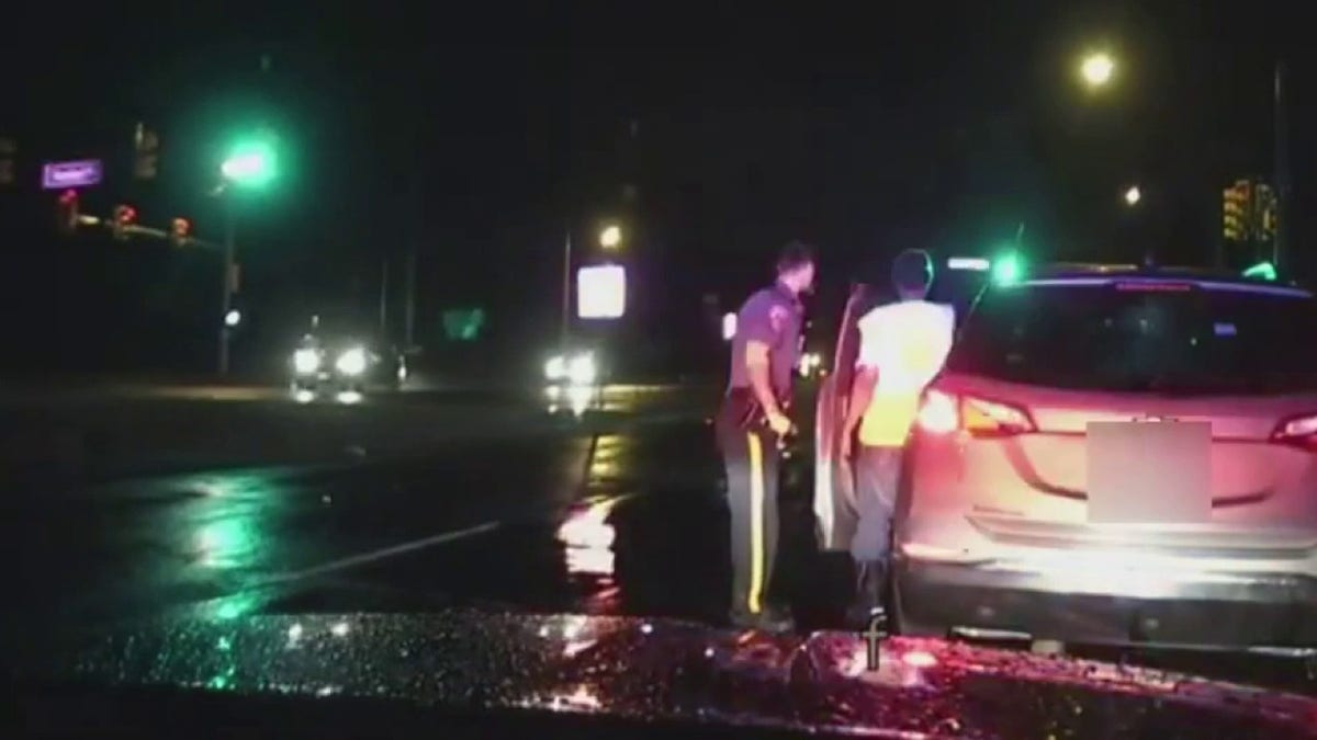 police officer helping driver