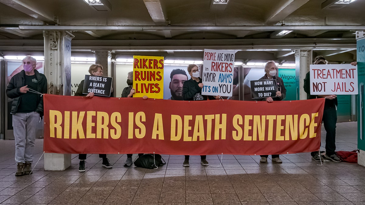 Protesters push to close Rikers Island in Times Square Subway Station