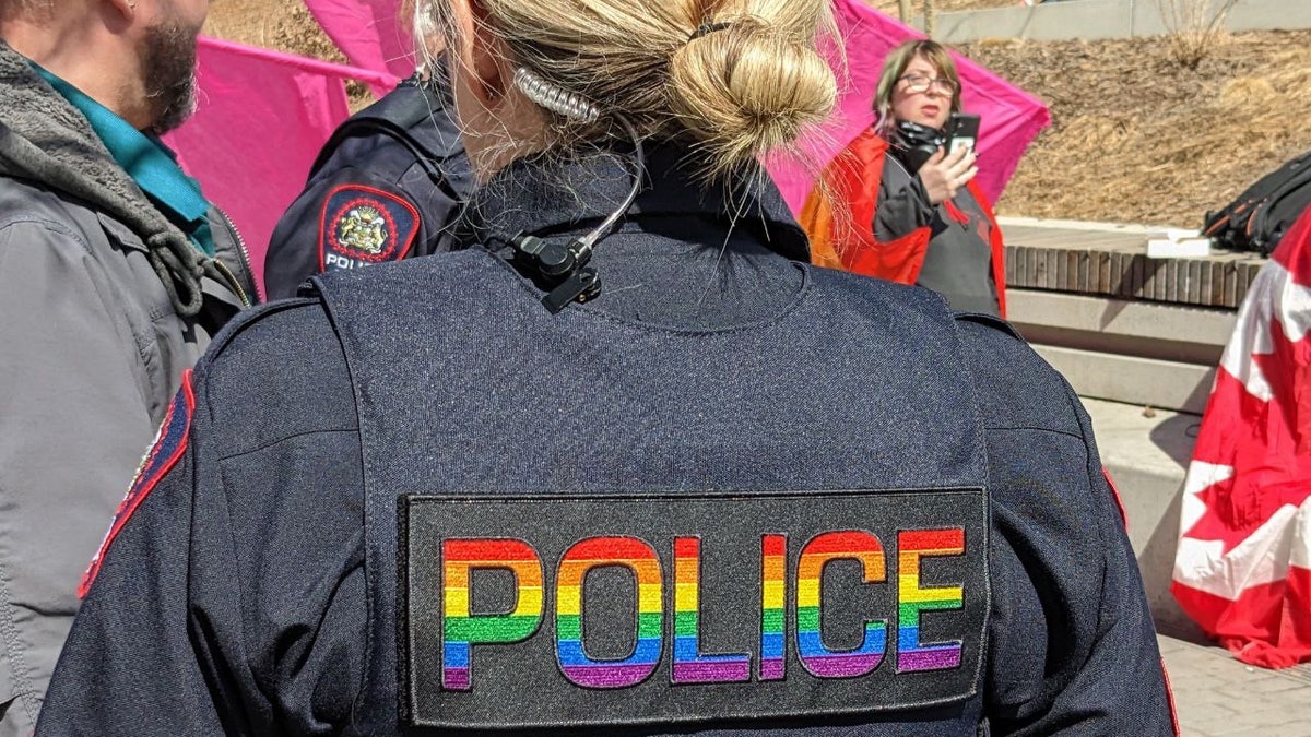 Calgary police officer with rainbow vest