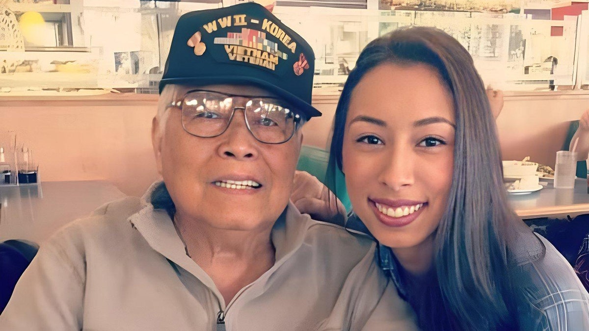 Nina Cashs father Francisco smiling next to his granddaugher