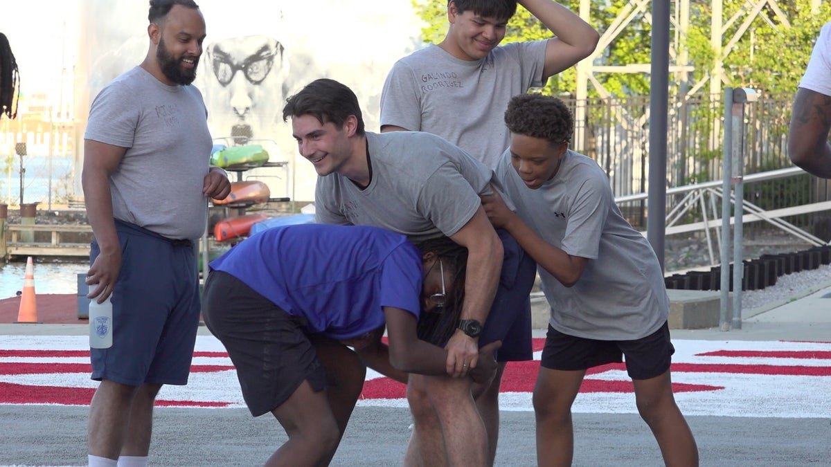 Baltimore police offer trainees and boys bond at fitness challenge 