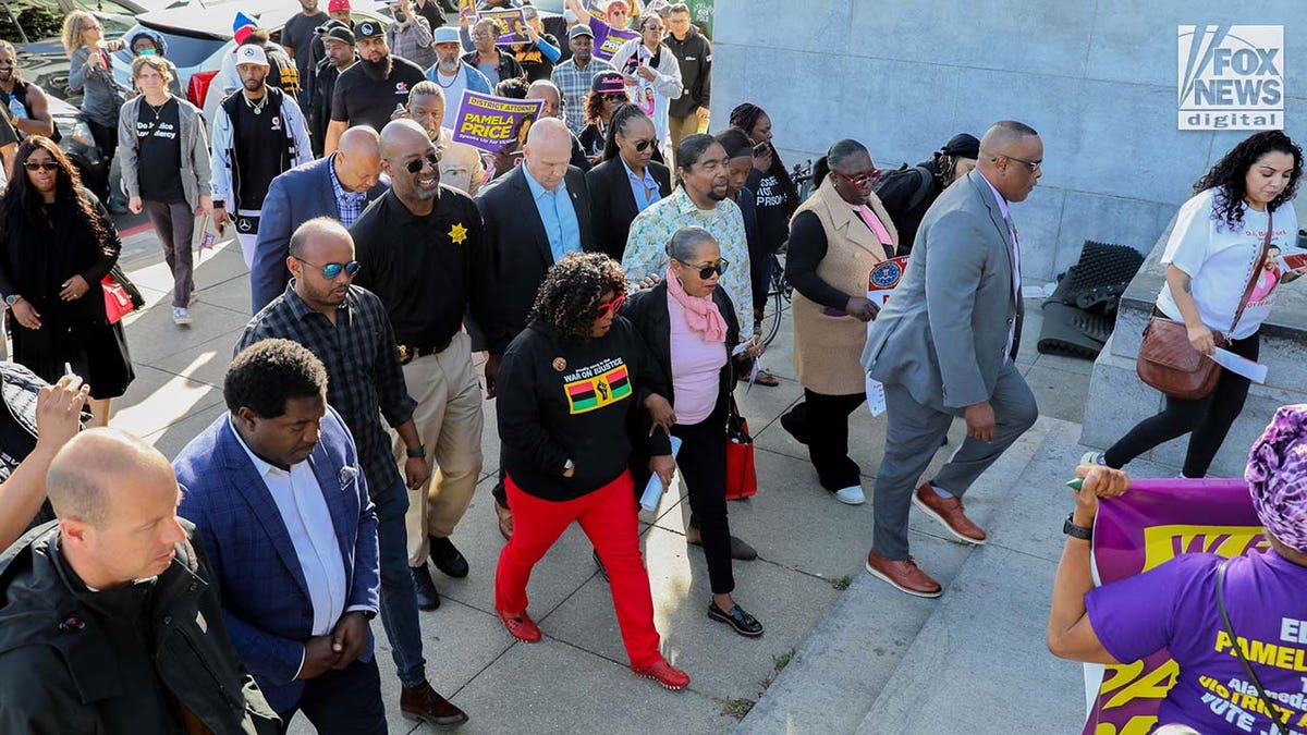 Supporters of Alameda County DA, Pamela Rice gather at a rally outside of Alameda County Courthouse