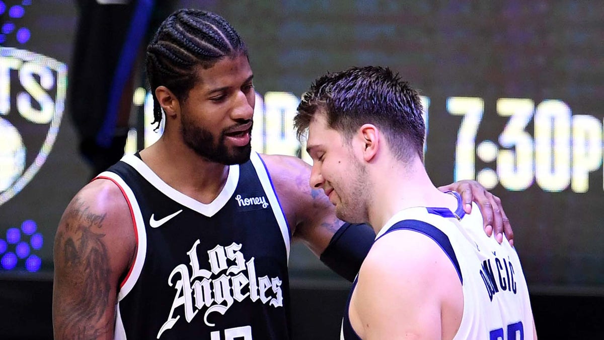Paul George talks to Luka Doncic