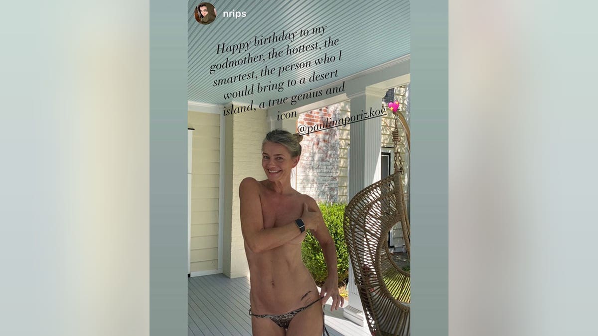 Paulina Porizkova covers here chest and positions her hand near her bikini bottoms to show off a hip tattoo in a birthday post she reposted to Instagram