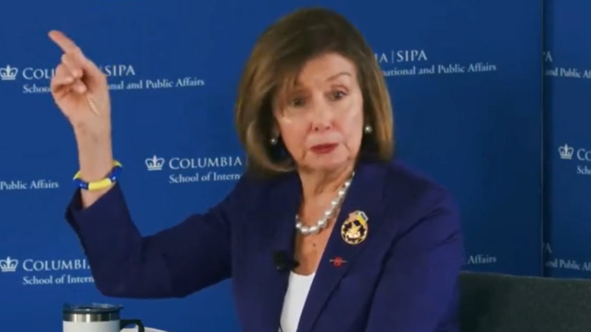 Pelosi wearing a pin with American and Ukrainian flags, 