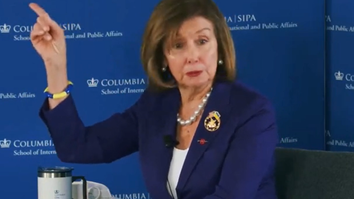 Pelosi wearing a pin with American and Ukrainian flags, 